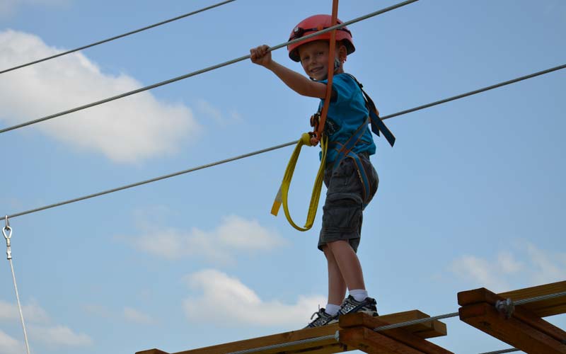 Child crosses the chain bridge at Gatorland